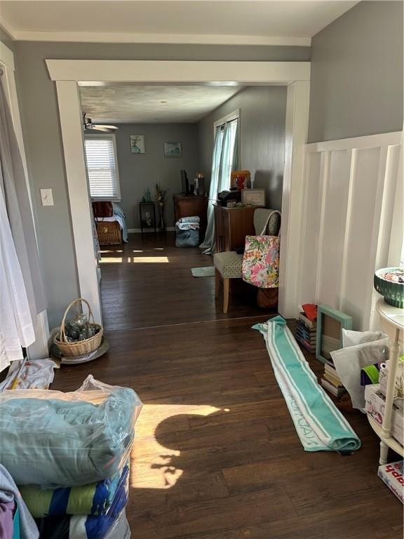 interior space with a decorative wall and wood finished floors