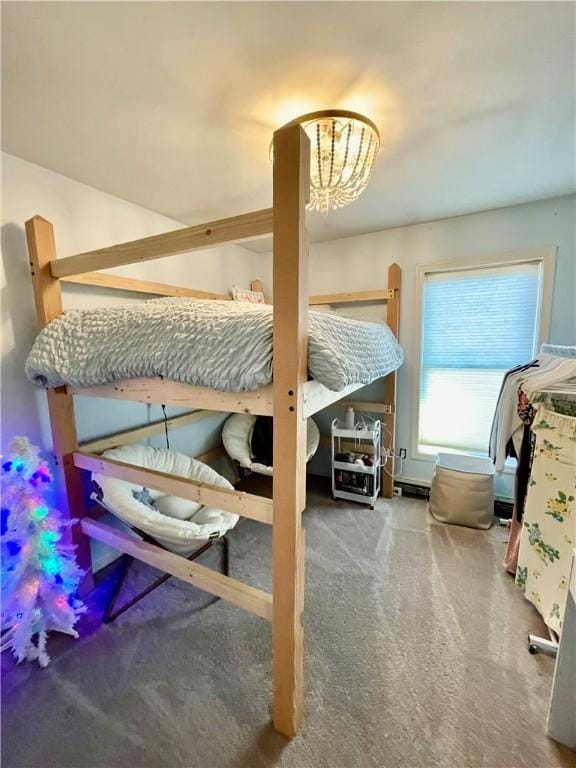 carpeted bedroom featuring an inviting chandelier