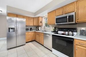 500 Kingstown Rd Unit 3B, Richmond, RI 02892 - kitchen featuring stainless steel appliances, a sink, light countertops, and light tile patterned floors