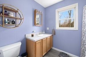 500 Kingstown Rd Unit 3B, Richmond, RI 02892 - bathroom with vanity, toilet, and wood finished floors