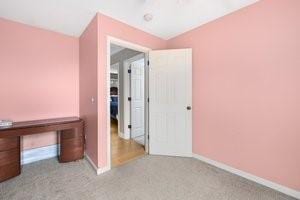 500 Kingstown Rd Unit 3B, Richmond, RI 02892 - unfurnished bedroom with vaulted ceiling and baseboards