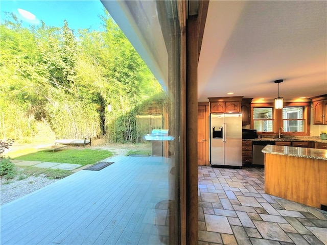 view of patio featuring an outdoor kitchen and a sink