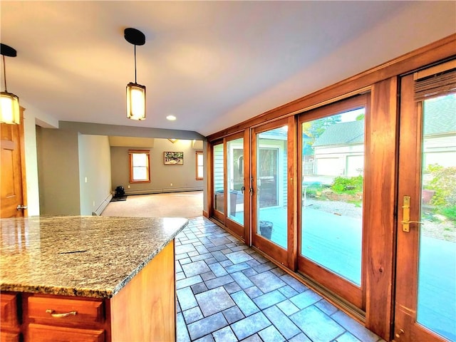 interior space featuring baseboard heating, french doors, stone finish flooring, and baseboards