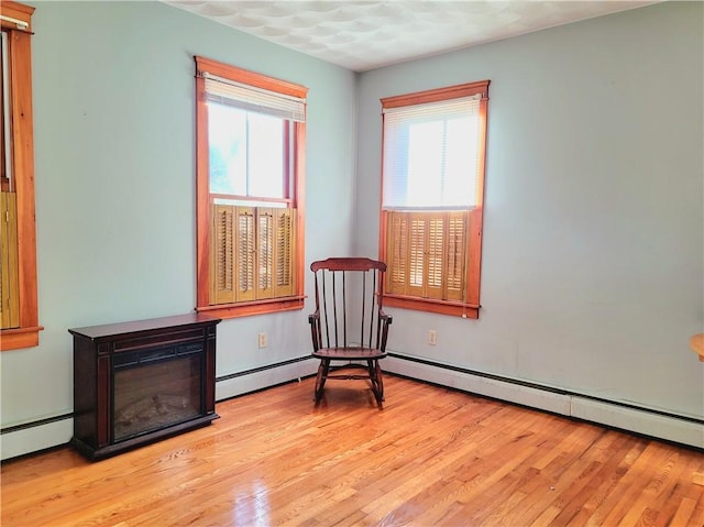 sitting room with light wood-type flooring