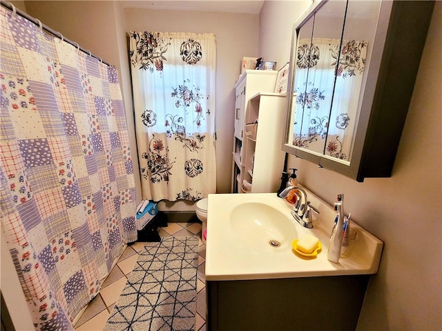 full bathroom featuring tile patterned floors, toilet, and vanity