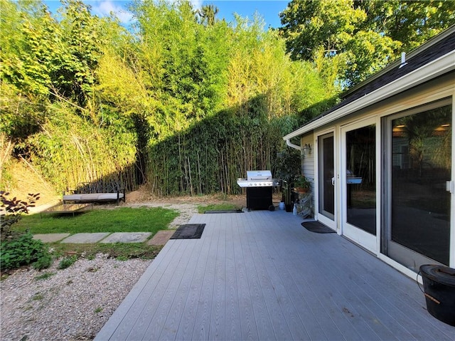 view of patio / terrace with a deck and a grill