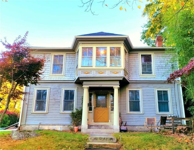 view of front of property with a chimney