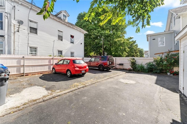 uncovered parking lot with fence