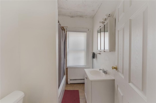 full bath with shower / bath combo with shower curtain, toilet, tile patterned flooring, baseboard heating, and vanity