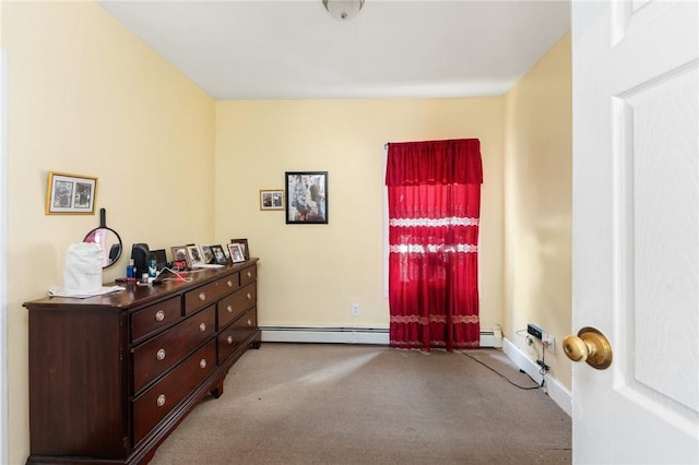 interior space featuring a baseboard heating unit and baseboards