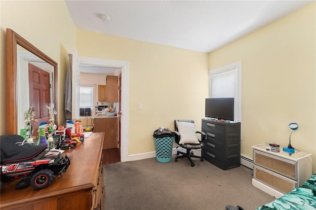 carpeted bedroom featuring baseboards and a baseboard radiator