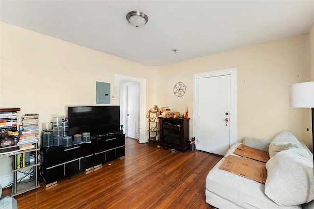 living area with electric panel and dark wood-style floors