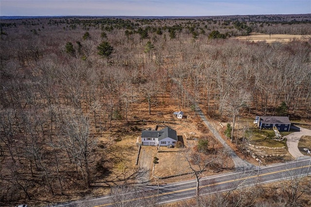 drone / aerial view featuring a view of trees