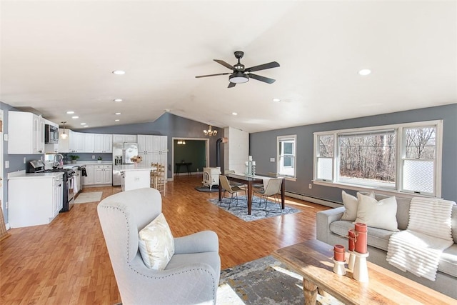 living area with vaulted ceiling, recessed lighting, light wood-type flooring, and ceiling fan