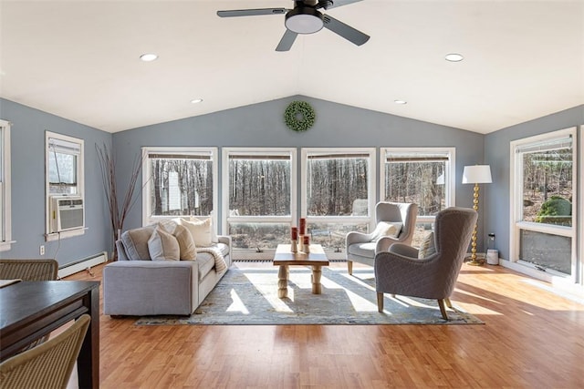 living area with wood finished floors, recessed lighting, ceiling fan, vaulted ceiling, and a baseboard heating unit