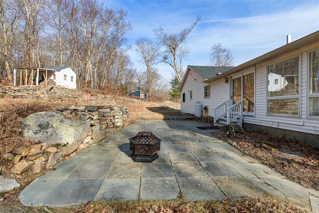 view of patio with an outdoor fire pit