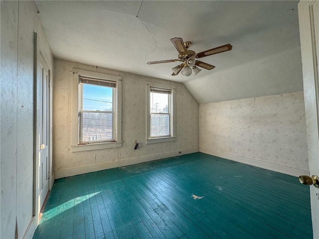 bonus room with vaulted ceiling, baseboards, a ceiling fan, and hardwood / wood-style floors