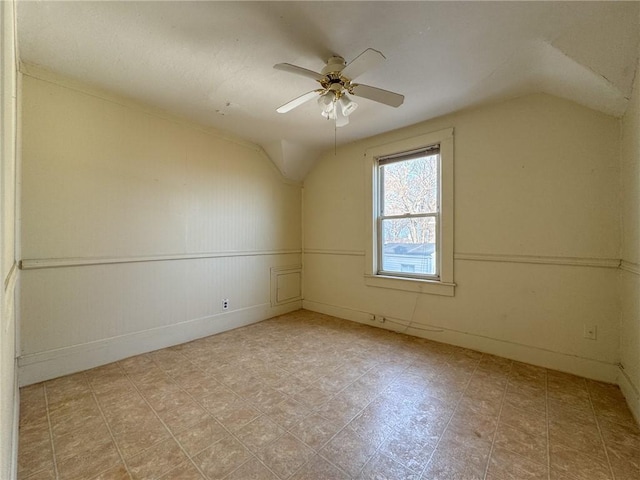 additional living space with lofted ceiling and ceiling fan