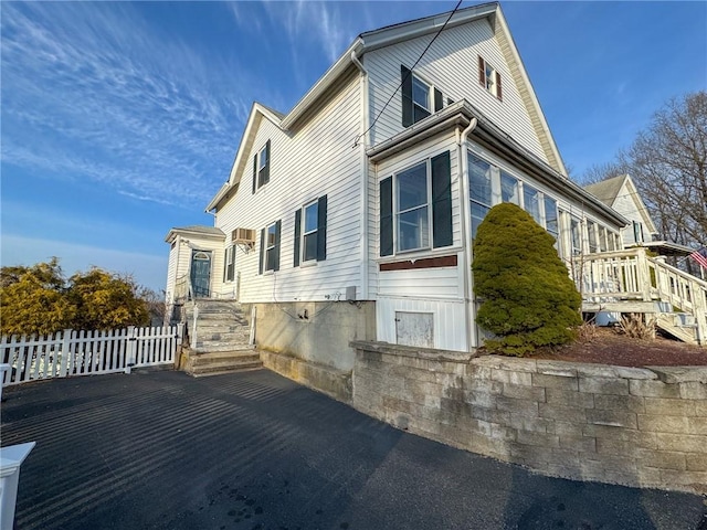 view of property exterior featuring fence