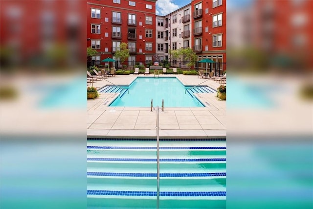 community pool featuring a patio area