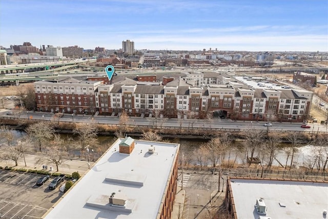 aerial view featuring a view of city and a water view