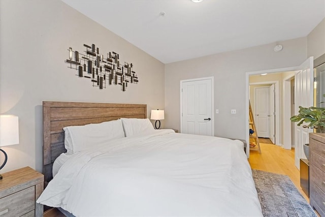 bedroom with light wood finished floors