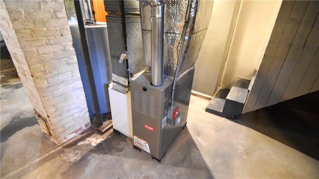 utility room with gas water heater