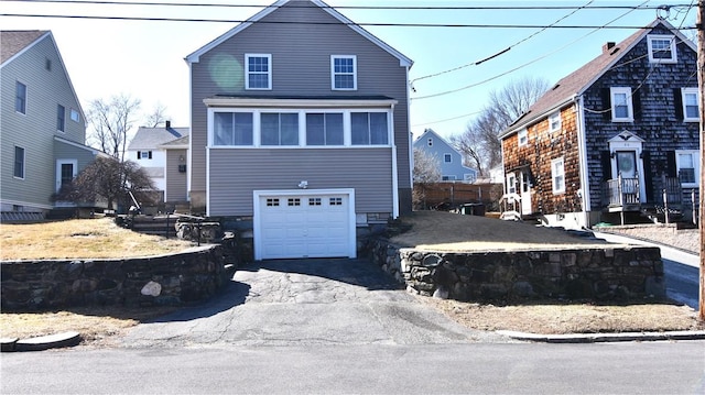 view of front of home featuring a garage and driveway