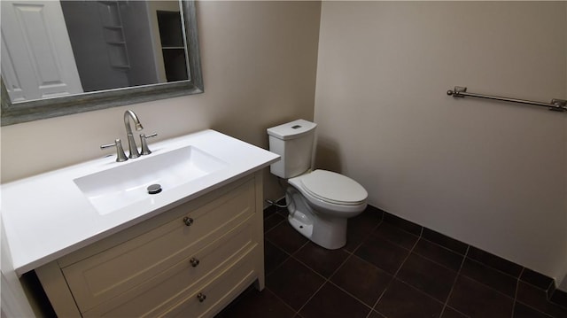 bathroom with tile patterned floors, toilet, and vanity