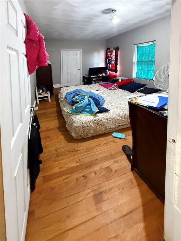 bedroom featuring light wood-style floors