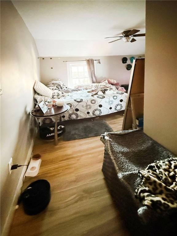 bedroom featuring a ceiling fan and wood finished floors