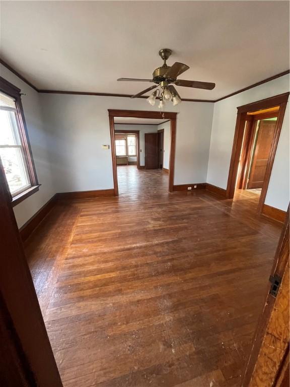 51 Oakland Ave, Cranston, RI 02910 - empty room with baseboards, ornamental molding, ceiling fan, and wood finished floors