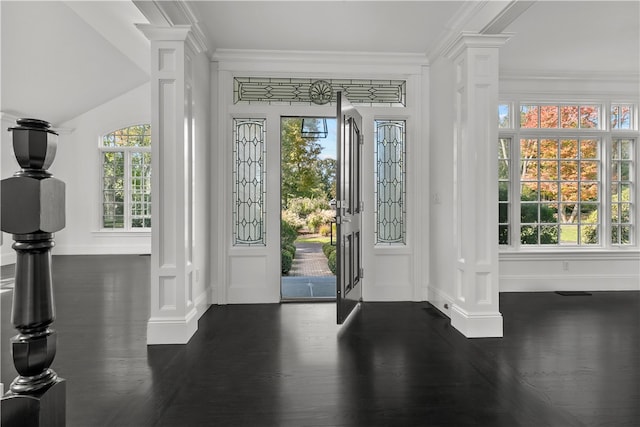 50 Kenyon Ave, East Greenwich, RI 02818 - entrance foyer featuring ornate columns, baseboards, dark wood-type flooring, and crown molding