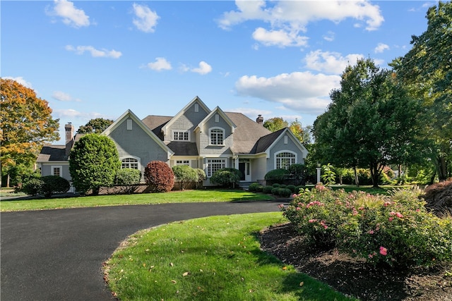 50 Kenyon Ave, East Greenwich, RI 02818 - view of front of house featuring a front yard and curved driveway