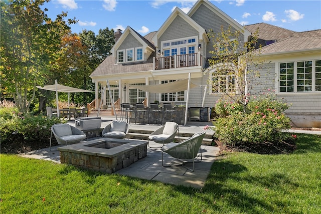 50 Kenyon Ave, East Greenwich, RI 02818 - back of house with a lawn, a balcony, a patio area, a fire pit, and a chimney