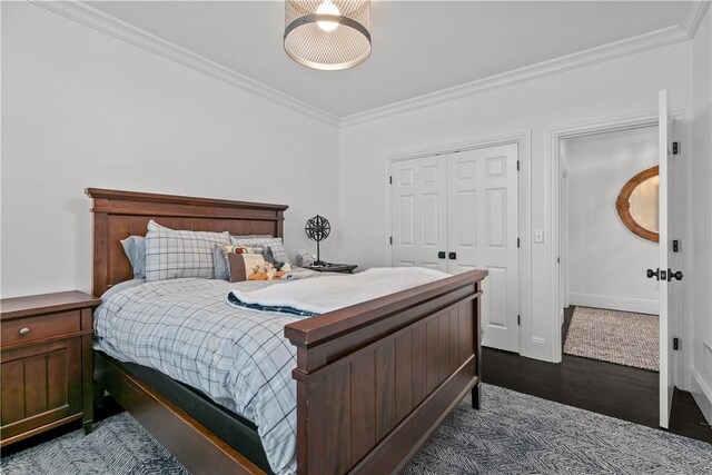 50 Kenyon Ave, East Greenwich, RI 02818 - bedroom featuring a closet, ornamental molding, and dark wood-type flooring