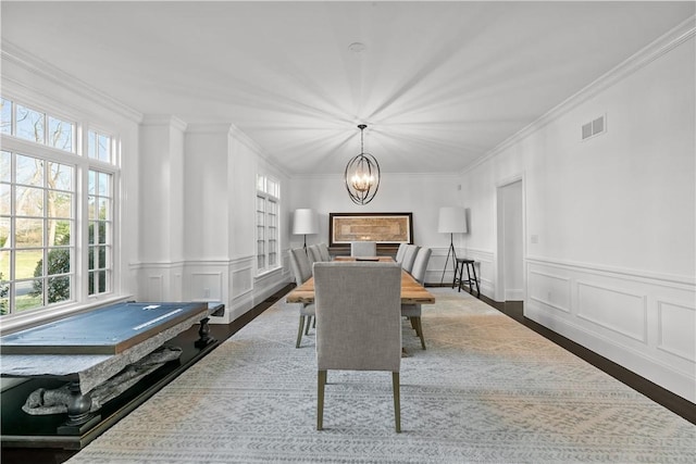 50 Kenyon Ave, East Greenwich, RI 02818 - dining room with visible vents, crown molding, and an inviting chandelier