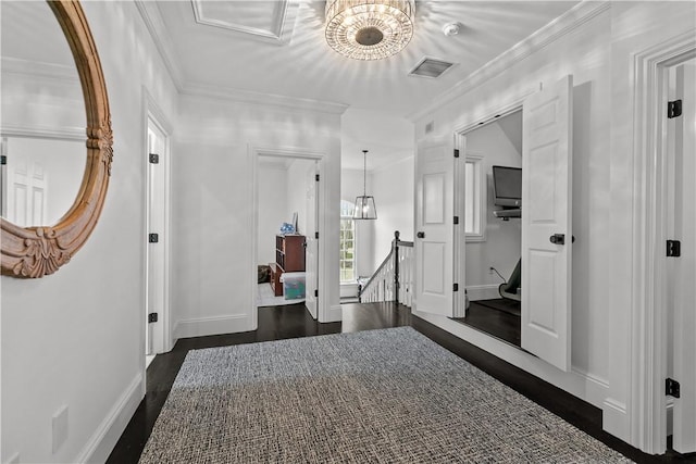 50 Kenyon Ave, East Greenwich, RI 02818 - corridor with an upstairs landing, visible vents, crown molding, dark wood-type flooring, and a notable chandelier