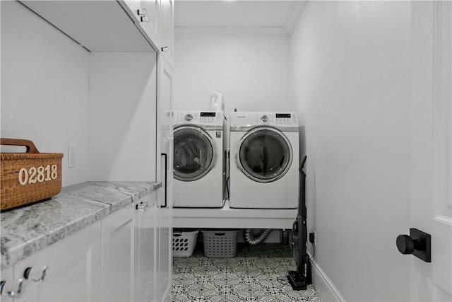 50 Kenyon Ave, East Greenwich, RI 02818 - washroom featuring cabinet space, tile patterned floors, washer and dryer, and crown molding