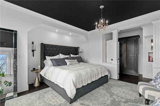 50 Kenyon Ave, East Greenwich, RI 02818 - bedroom with decorative columns, a notable chandelier, crown molding, and wood finished floors