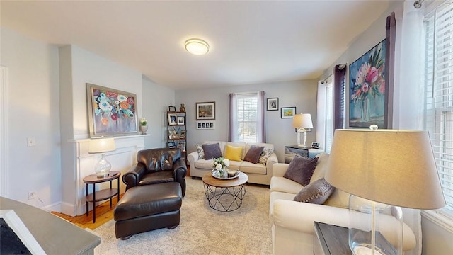 living room with wood finished floors and baseboards