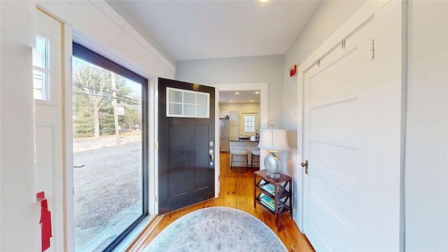 entryway featuring recessed lighting, plenty of natural light, and light wood-style flooring