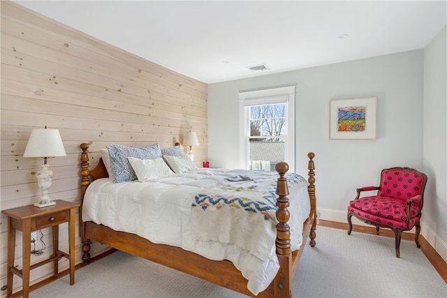 bedroom featuring visible vents and baseboards