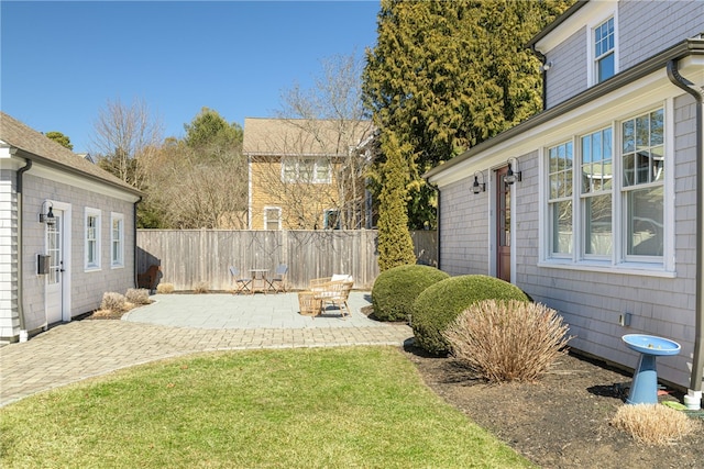 view of yard with a patio and fence