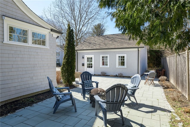 view of patio / terrace featuring fence private yard and an outdoor fire pit