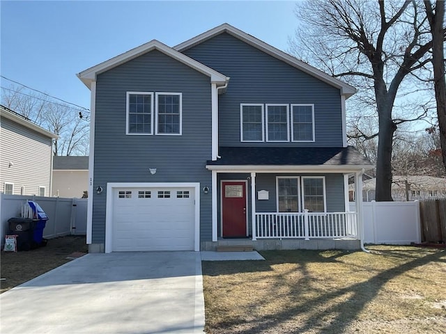 traditional home with a porch, concrete driveway, a garage, and fence