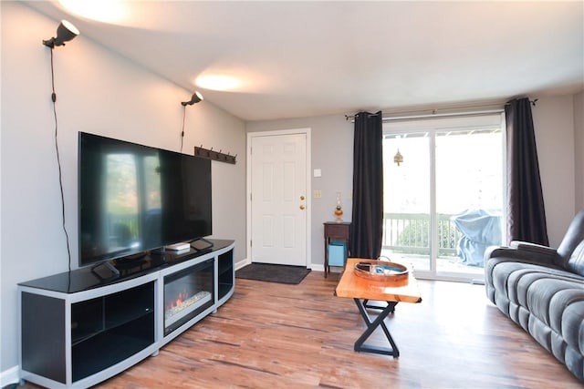 living room with wood finished floors and baseboards