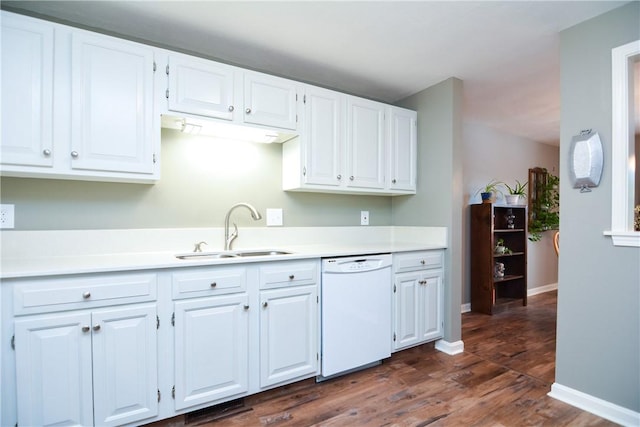 kitchen featuring a sink, white cabinets, light countertops, and white dishwasher