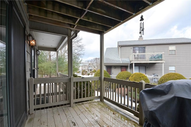 wooden terrace featuring area for grilling