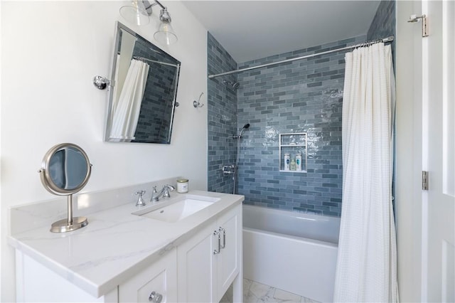 bathroom with marble finish floor, vanity, and shower / bathtub combination with curtain